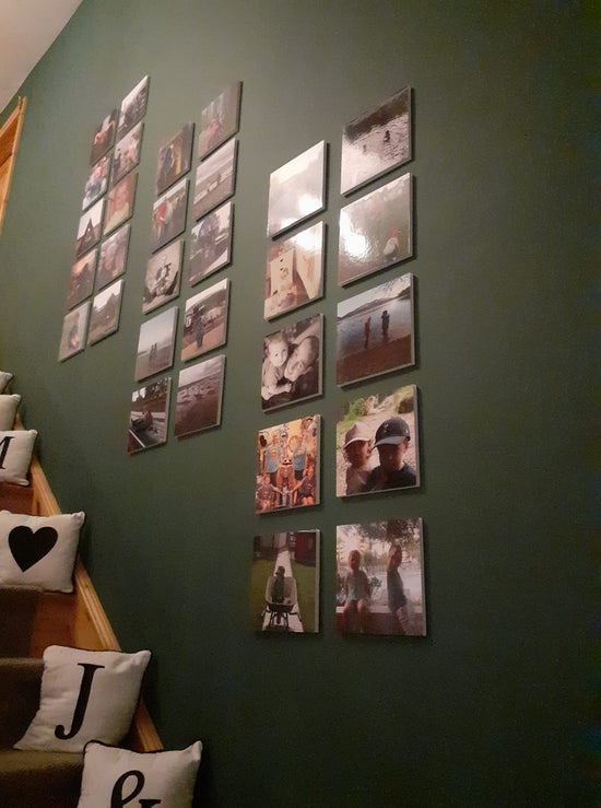 60 photo tiles on wall with stairs